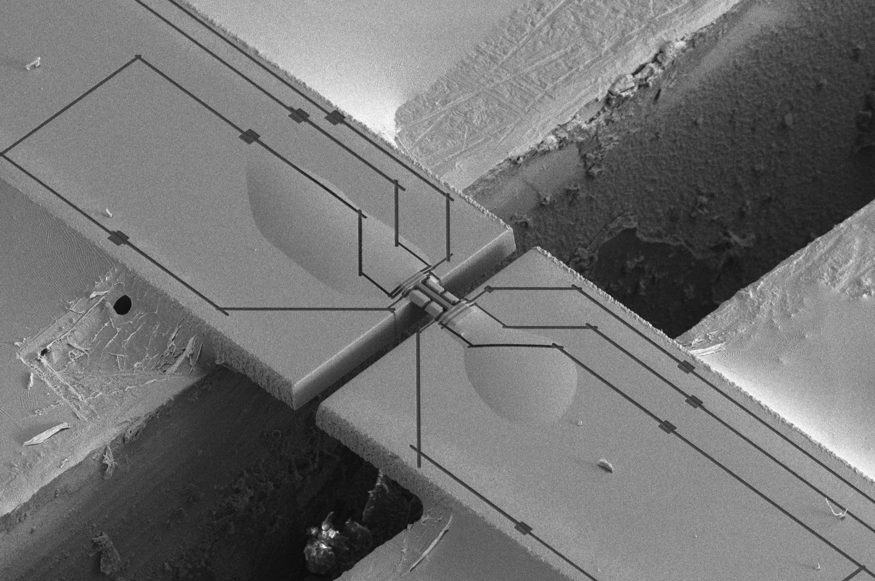Scanning electron micrograph of a suspended microfabricated structure: two released beams meeting at a narrow lithographically defined junction.